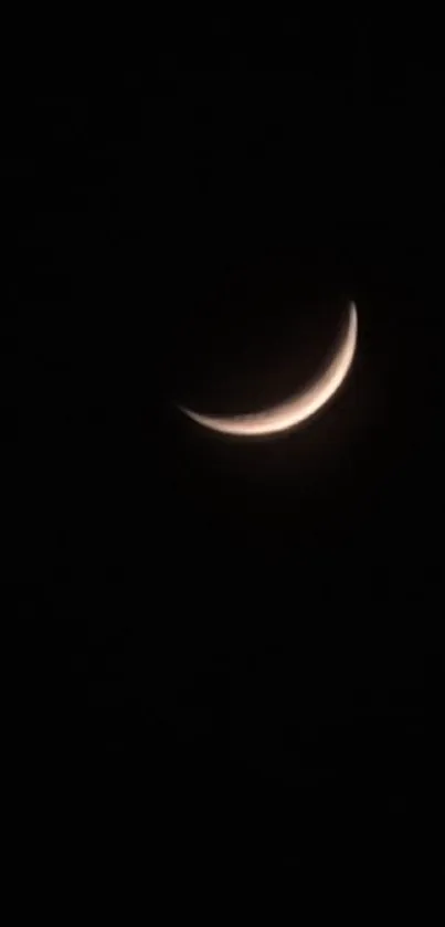 Serene crescent moon in a dark night sky background.