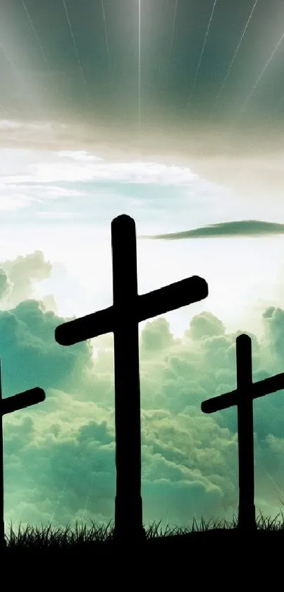 Three crosses silhouetted against a radiant, sunlit sky.