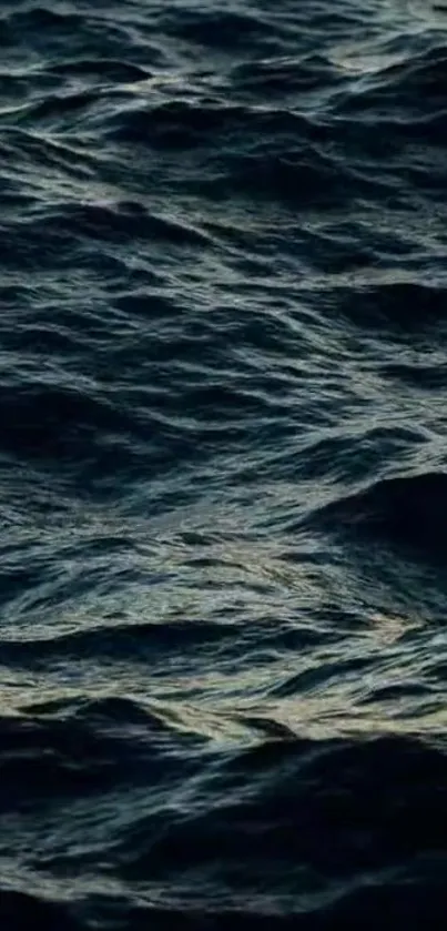 Dark ocean waves creating a serene mobile wallpaper.
