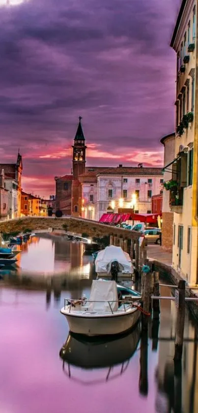 Serene evening canal view with vibrant sunset.