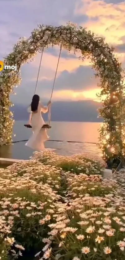 A woman in white on a floral swing at sunset by the ocean.