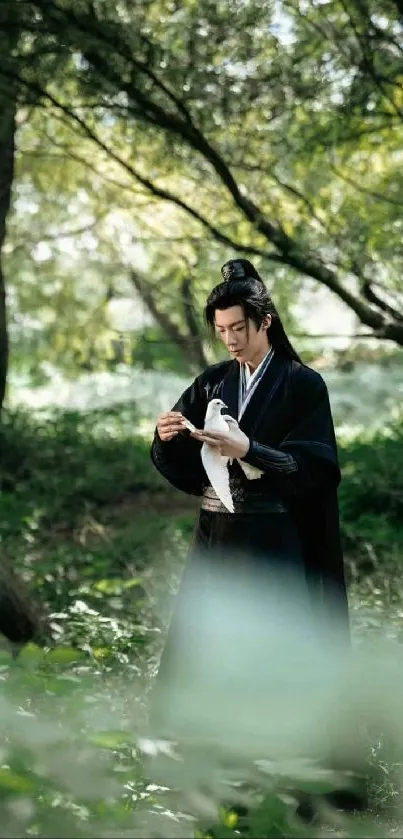 Person in traditional attire holding a bird in a lush green forest setting.