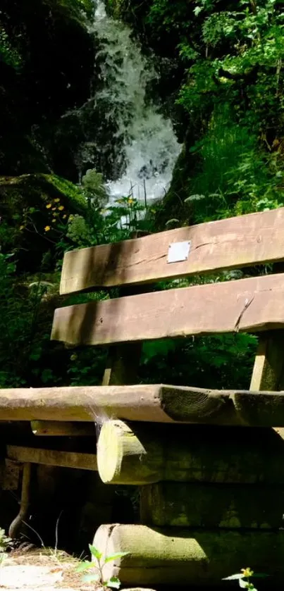 Wooden park bench in a lush forest with a waterfall.