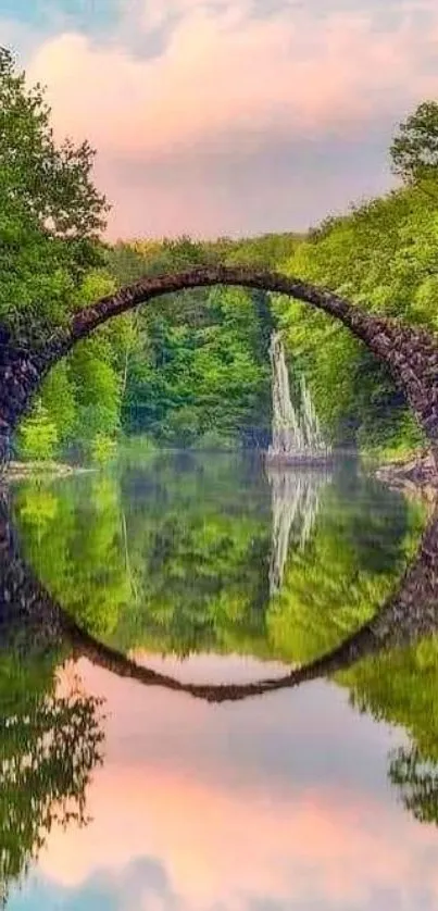 Stone bridge reflected on a serene lake amidst lush forest.