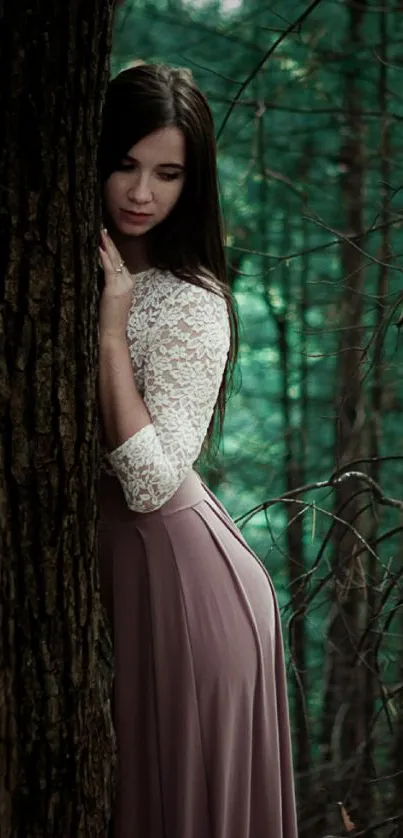 Woman in lace dress standing by a tree in a serene forest.