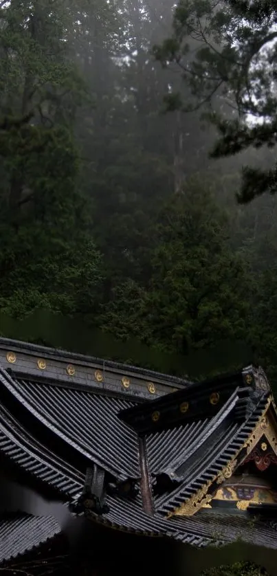 Traditional Japanese temple roof amidst misty forest.