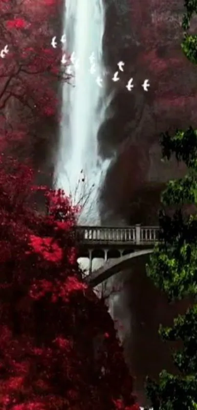 Serene waterfall with red forest and bridge.