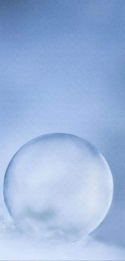 Serene frosted sphere on a blue icy background, perfect for a calming mobile wallpaper.