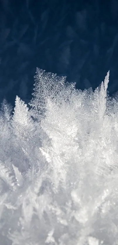 Close-up of frosted ice crystals with a blue background, perfect for calming wallpaper.