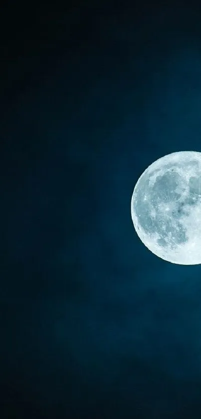 Full moon in a dark blue night sky wallpaper.