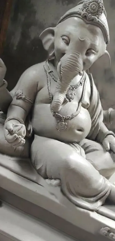 Ganesha sculpture in serene artistic pose. Perfect for phone wallpaper.