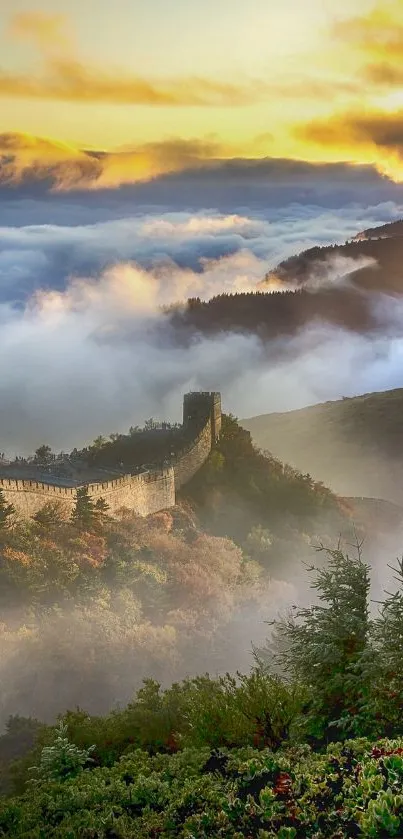 Great Wall of China at sunrise enveloped in mist and clouds.