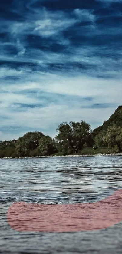 Hilltop by a serene blue lake with lush greenery and skies overhead.