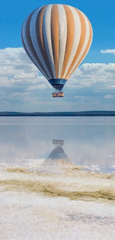 Hot air balloon floats over tranquil landscape with blue skies.