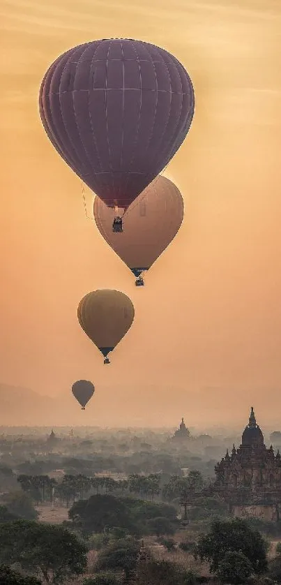 Hot air balloons float above ancient temples at sunrise.