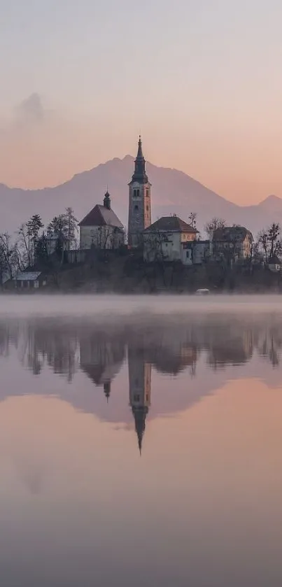 Island church reflected in a misty lake at dawn, serene wallpaper.