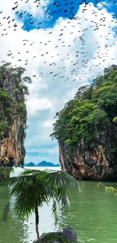 Tropical island scene with towering rocks and lush greenery over calm waters.