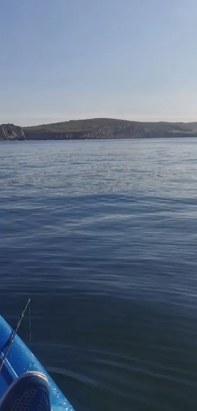 A serene kayaking scene on calm blue waters under a clear sky.