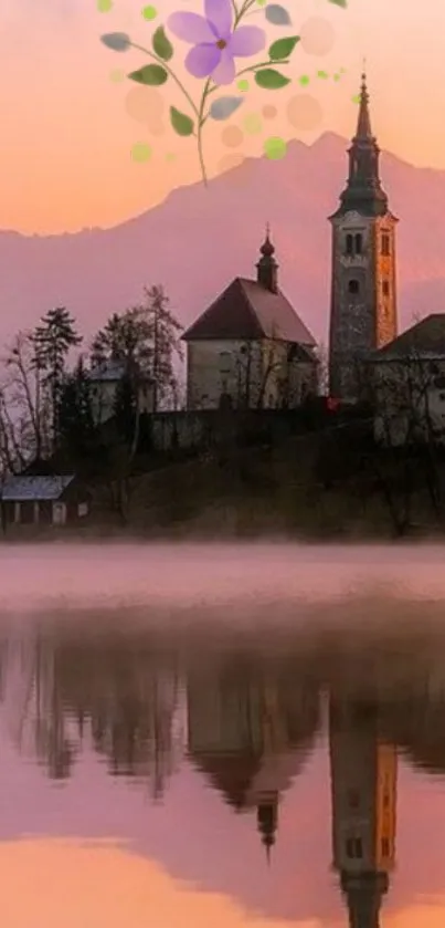 Calm lake reflection with chapel and mountains under a pink sky.