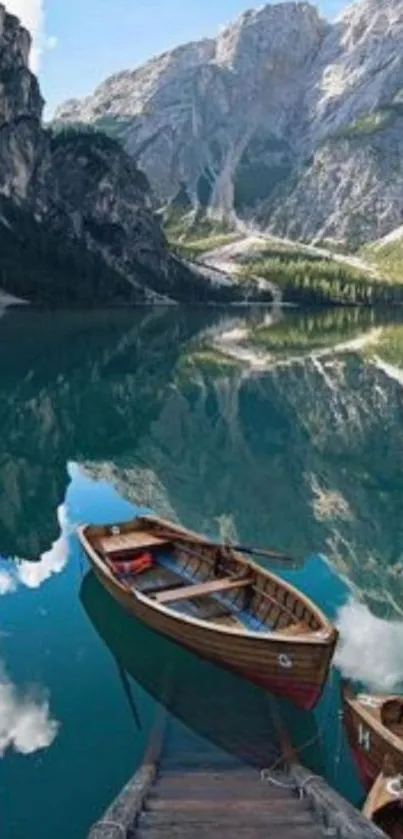 Peaceful mountain lake with wooden boats and reflections.