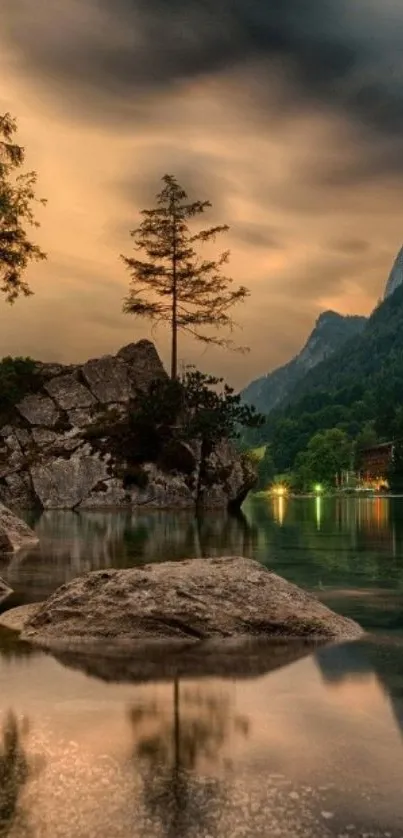 Serene mountain lakeside at sunset with reflections.