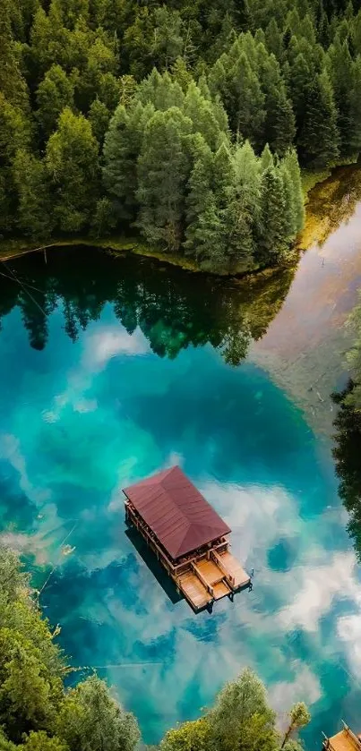 Serene cabin by a clear lake with lush green forest backdrop.