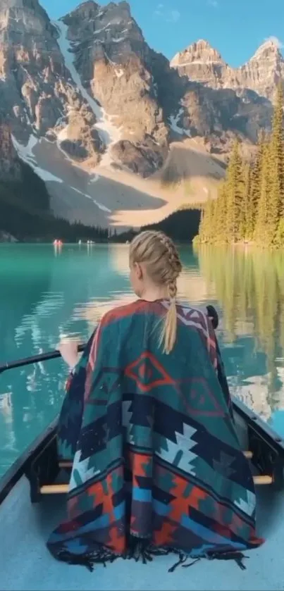 Peaceful lake canoeing under majestic mountains.