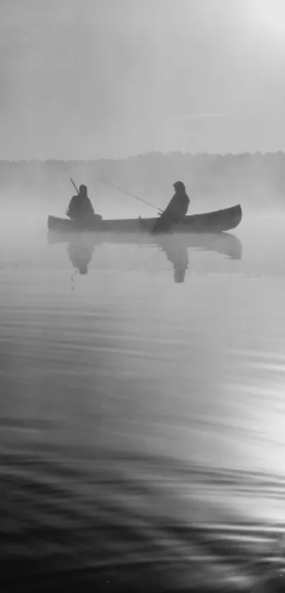 Serene grayscale wallpaper with two canoeists on a misty lake.