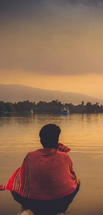 Serene evening lake view with figure in solitude.