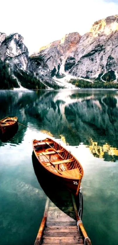 Wooden boats on a tranquil lake with mountains in the background.