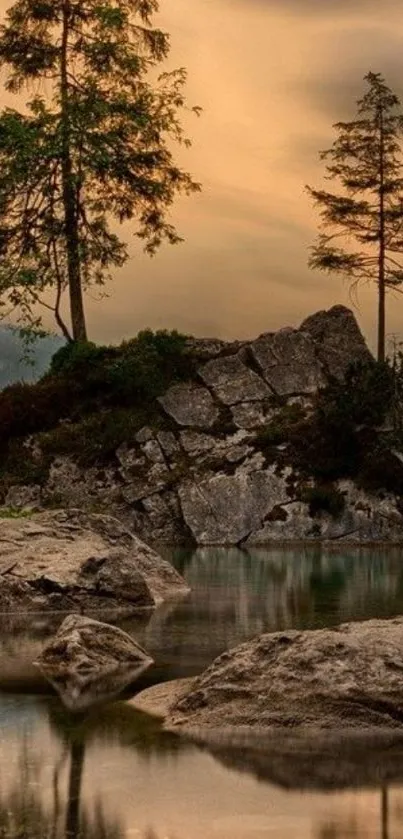 Serene sunset over a rocky lake with silhouetted trees.