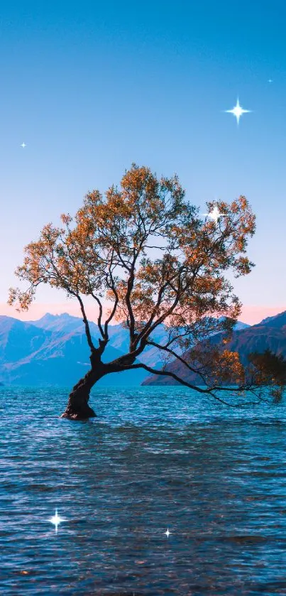 Wallpaper of a solitary tree in a serene lake with mountains and a clear blue sky.