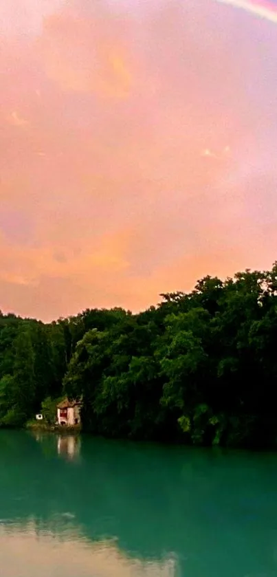 Serene lake with a rainbow and lush greenery.