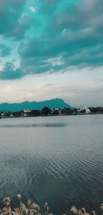 Tranquil lake and turquoise sky with distant mountains.