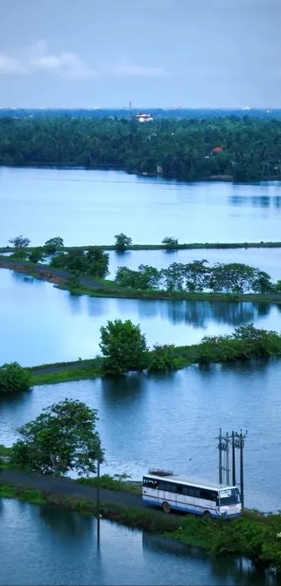 Calm lake with lush greenery and a solitary bus on a country road.