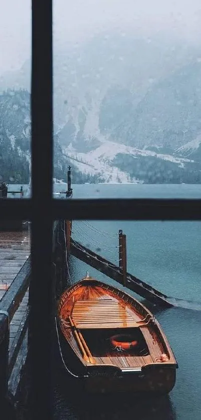 Serene view of a wooden boat at a misty lake through a windowpane.