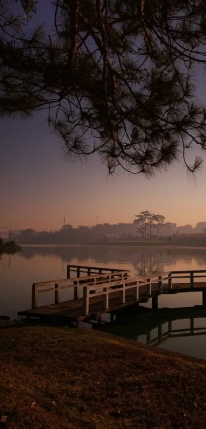 Serene dusk at a tranquil lakeside with silhouettes.