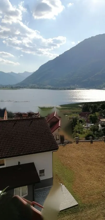 Serene view of lake and mountains under a sunny blue sky.