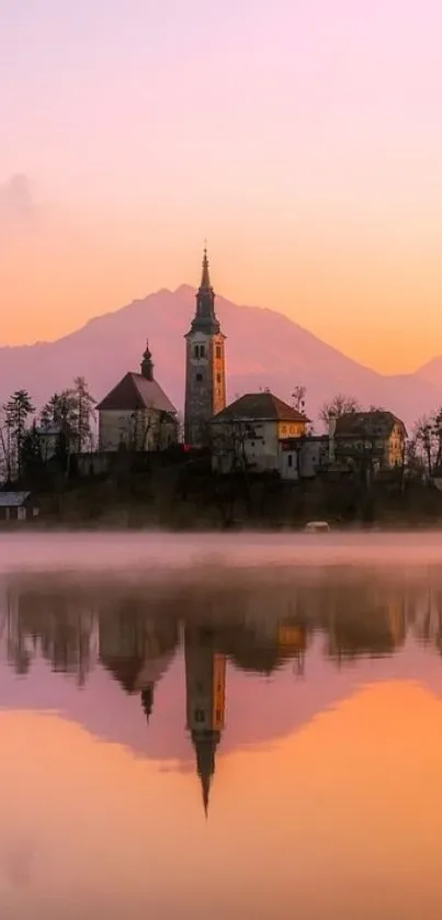 Serene sunset over a tranquil lakeside with orange and pink hues.