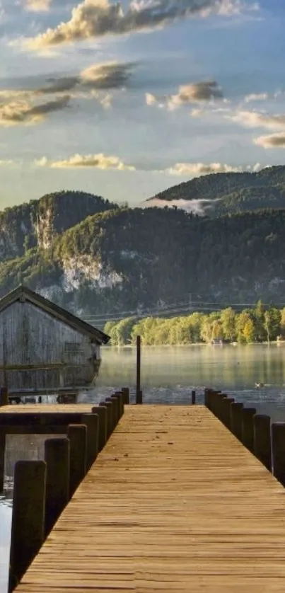 Serene lakeside view with wooden dock and mountains.