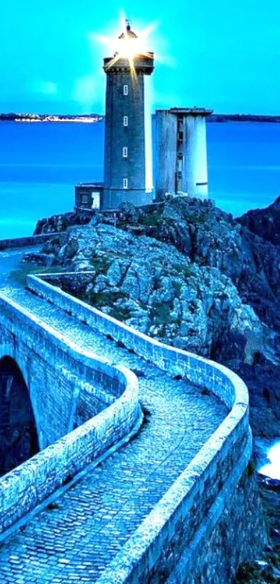 Lighthouse against a vibrant blue ocean with a winding cobblestone path.