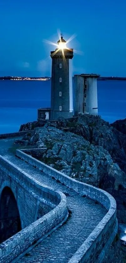 Lighthouse at night with ocean view.