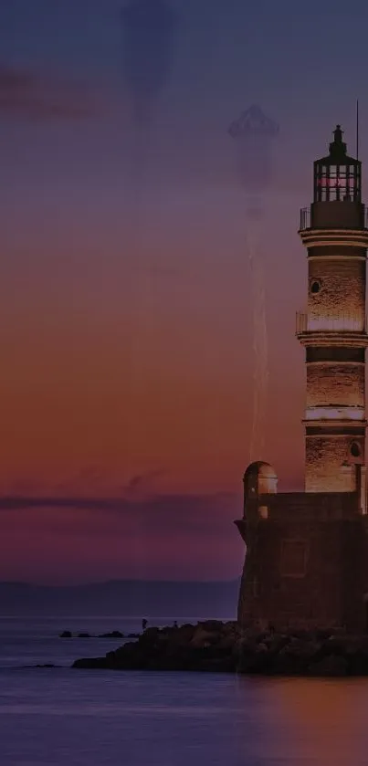 Lighthouse against a sunset sky with ocean view.