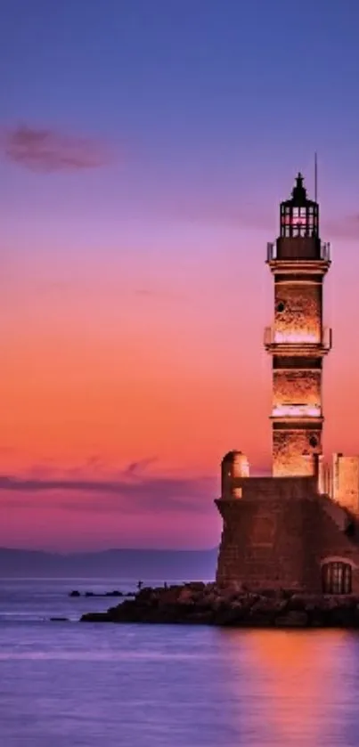 A serene sunset with lighthouse against a vibrant orange and purple sky landscape.