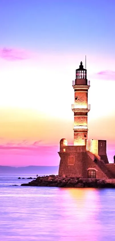 Tranquil lighthouse silhouetted at sunset with vivid purple and pink sky.