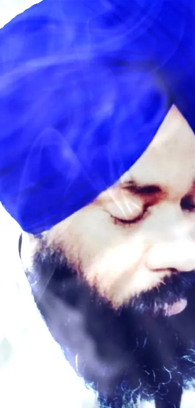 Serene man wearing a blue turban with peaceful expression, close-up portrait.