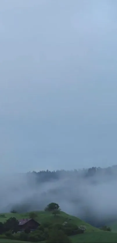 Misty hills under a serene blue sky.