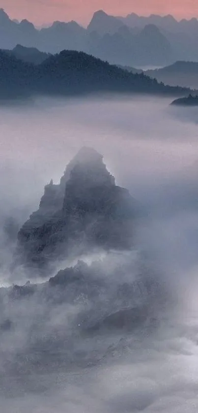 Serene misty mountain peaks at sunset.