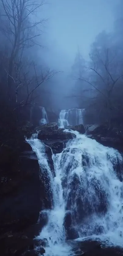 Misty waterfall flowing amidst a serene forest setting in shades of blue.