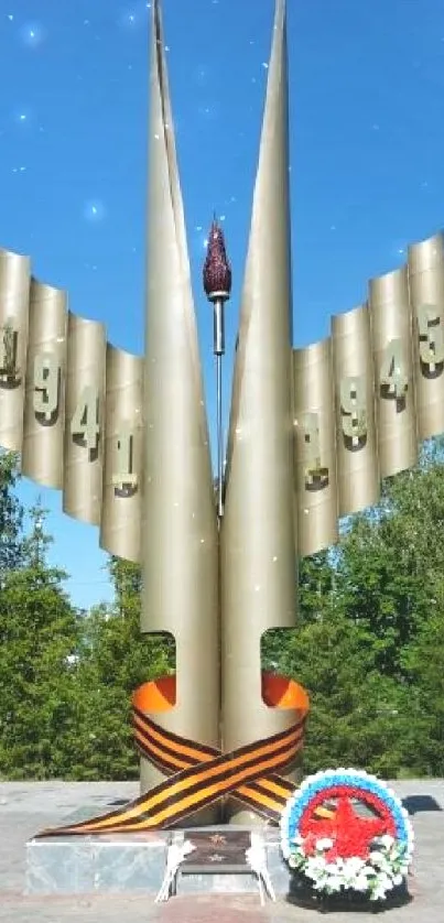 Monument surrounded by greenery under a clear blue sky.